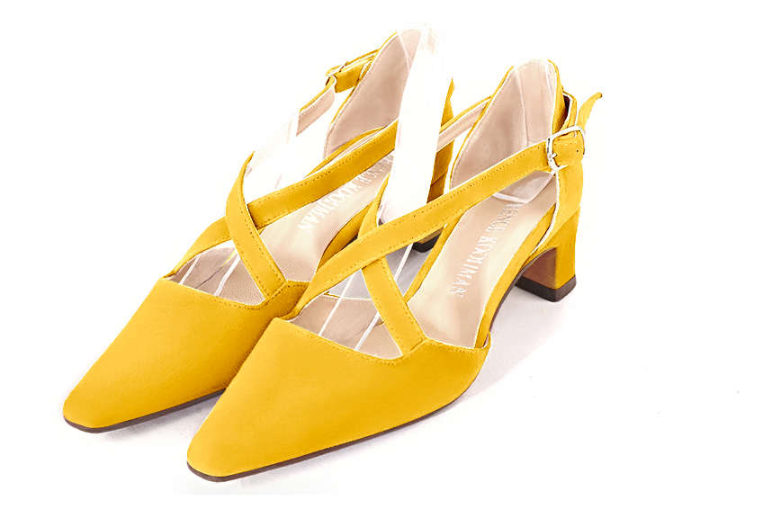 Yellow women's open side shoes, with crossed straps. Tapered toe. Low kitten heels. Front view - Florence KOOIJMAN